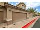 Close-up of garages and landscape at 6655 Flaminian Ln # 104, North Las Vegas, NV 89084