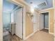 Hallway with a view into the baby's room showcasing wood-look flooring and updated paint at 6655 Flaminian Ln # 104, North Las Vegas, NV 89084