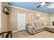 Comfortable living room with a gray sofa, stylish decor, and ample natural light at 6655 Flaminian Ln # 104, North Las Vegas, NV 89084