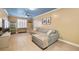 Cozy living room featuring a comfortable sofa, stylish decor, and large windows at 6655 Flaminian Ln # 104, North Las Vegas, NV 89084