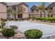 Community volleyball court with lush landscaping situated between apartment buildings at 6655 Flaminian Ln # 104, North Las Vegas, NV 89084