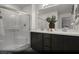 Modern primary bathroom featuring a double sink vanity and a glass-enclosed shower at 6698 Nimbus Ave # Lot 17, Las Vegas, NV 89130