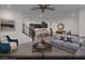 Open-concept living room and kitchen area with modern furnishings and ample natural light at 6698 Nimbus Ave # Lot 17, Las Vegas, NV 89130