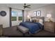 Serene primary bedroom with a large window and a comfortable king-sized bed at 6698 Nimbus Ave # Lot 17, Las Vegas, NV 89130
