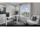Bright bedroom with comfortable seating, modern decor, and ample natural light at 6716 Nimbus Ave # Lot 14, Las Vegas, NV 89130