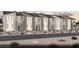 Row of modern townhouses, each with a balcony and desert landscaping for an appealing curb appeal at 6716 Nimbus Ave # Lot 14, Las Vegas, NV 89130