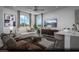 Bright living room with modern furniture, ceiling fan, and ample natural light at 6716 Nimbus Ave # Lot 14, Las Vegas, NV 89130