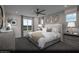 Serene primary bedroom with neutral tones, large bed, and plenty of natural light at 6716 Nimbus Ave # Lot 14, Las Vegas, NV 89130