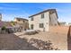 Large backyard with a patio area, above ground pool, gravel landscaping, and block fence at 6857 Stone Tower Ct, Las Vegas, NV 89149