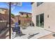 Backyard featuring a block wall, barbecue grill, above-ground pool, and patio area with outdoor seating at 6857 Stone Tower Ct, Las Vegas, NV 89149