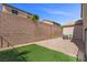 A section of well maintained backyard with an artificial turf section at 6857 Stone Tower Ct, Las Vegas, NV 89149