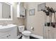 Clean bathroom with vanity, toilet, and decorative wall art at 6857 Stone Tower Ct, Las Vegas, NV 89149