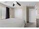 Neutral bedroom with a closet, ceiling fan, and carpeted floors at 6857 Stone Tower Ct, Las Vegas, NV 89149