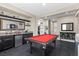 Inviting game room featuring a billiard table, wet bar area with storage, tile floor, and recessed lighting at 6857 Stone Tower Ct, Las Vegas, NV 89149