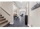 Main level hallway features tile floors and stairway to second level at 6857 Stone Tower Ct, Las Vegas, NV 89149