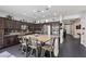 Gourmet kitchen with a large island, stainless steel appliances, and dark wood cabinets at 6857 Stone Tower Ct, Las Vegas, NV 89149