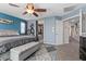 Bright main bedroom features a ceiling fan, and access to main bathroom suite at 6857 Stone Tower Ct, Las Vegas, NV 89149