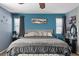 Main bedroom features a ceiling fan, picture window and adjacent sitting area at 6857 Stone Tower Ct, Las Vegas, NV 89149
