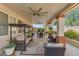 Covered back patio with swing and outdoor dining area overlooking the yard at 7112 Rancho De Taos Ct, Las Vegas, NV 89130