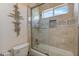 Bathroom shower featuring tile surround and glass door at 7112 Rancho De Taos Ct, Las Vegas, NV 89130