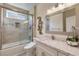 Modern bathroom features a tiled shower, glass door, and marble countertop at 7112 Rancho De Taos Ct, Las Vegas, NV 89130
