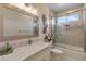 Bright bathroom with glass enclosed shower, granite countertop and contemporary fixtures at 7112 Rancho De Taos Ct, Las Vegas, NV 89130