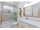 Modern bathroom featuring a shower-tub combination with decorative tile and granite counter at 7112 Rancho De Taos Ct, Las Vegas, NV 89130