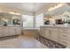 Bathroom featuring dual vanities, large mirrors, and a corner tub at 7112 Rancho De Taos Ct, Las Vegas, NV 89130