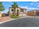 Well-maintained two-story home with stone accents, balcony, and a three-car garage at 7112 Rancho De Taos Ct, Las Vegas, NV 89130