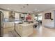 Bright kitchen with stainless steel appliances, island with seating, and modern finishes at 7112 Rancho De Taos Ct, Las Vegas, NV 89130