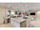 Open concept kitchen boasts a large island, stainless steel appliances, and view to the living area at 7112 Rancho De Taos Ct, Las Vegas, NV 89130
