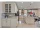 Spacious kitchen with island, stainless steel appliances, tiled flooring, and ample cabinetry at 7112 Rancho De Taos Ct, Las Vegas, NV 89130