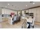 Gourmet kitchen featuring an island with seating, white cabinetry, and modern appliances at 7112 Rancho De Taos Ct, Las Vegas, NV 89130