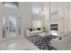 Bright living room featuring a fireplace, high ceilings, and stylish decor at 7112 Rancho De Taos Ct, Las Vegas, NV 89130