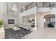 Spacious living room showcasing a fireplace, chandelier, and open floor plan at 7112 Rancho De Taos Ct, Las Vegas, NV 89130