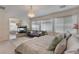 Beautiful main bedroom with fireplace, chandelier, and scenic backyard views at 7112 Rancho De Taos Ct, Las Vegas, NV 89130