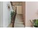 Carpeted staircase with decorative railings leads to the upper level at 7112 Rancho De Taos Ct, Las Vegas, NV 89130