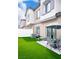 Backyard featuring artificial grass, patio, BBQ grill, and an outdoor seating area at 7342 N Decatur Blvd # 5, Las Vegas, NV 89131