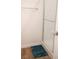 Bright bathroom features a glass enclosed shower with white subway tile and a blue bath mat on a wood look floor at 7342 N Decatur Blvd # 5, Las Vegas, NV 89131