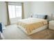 Inviting bedroom showcases natural light, neutral color palette, comfortable bed, and soft carpeting at 7342 N Decatur Blvd # 5, Las Vegas, NV 89131