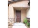 Inviting front door with stone accents, covered porch, and modern design at 7342 N Decatur Blvd # 5, Las Vegas, NV 89131