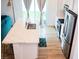Spacious kitchen featuring a large island, stainless steel appliances, and hardwood floors at 7342 N Decatur Blvd # 5, Las Vegas, NV 89131