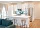 Open concept kitchen boasting a large island with seating and stainless steel appliances at 7342 N Decatur Blvd # 5, Las Vegas, NV 89131
