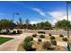 Outdoor basketball court with benches and landscaping, perfect for friendly games and fitness activities at 7404 Eggshell Dr, North Las Vegas, NV 89084