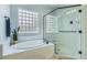 Clean, bright bathroom with separate glass enclosed shower and large soaking tub at 7404 Eggshell Dr, North Las Vegas, NV 89084