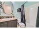 Bright bathroom with granite countertops and tub with shower at 7404 Eggshell Dr, North Las Vegas, NV 89084