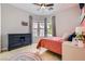 Bedroom featuring a large window and a colorful rug at 7404 Eggshell Dr, North Las Vegas, NV 89084