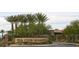Welcome to Club Aliante: A gated community entrance with lush landscaping at 7404 Eggshell Dr, North Las Vegas, NV 89084