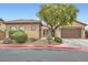 Inviting single-story home with well-maintained desert landscaping and attached garage at 7404 Eggshell Dr, North Las Vegas, NV 89084