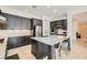 Bright and open kitchen with white countertops, sleek appliances, and a functional island at 7404 Eggshell Dr, North Las Vegas, NV 89084